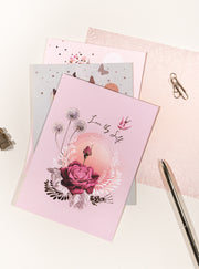 greeting cards with pen on table